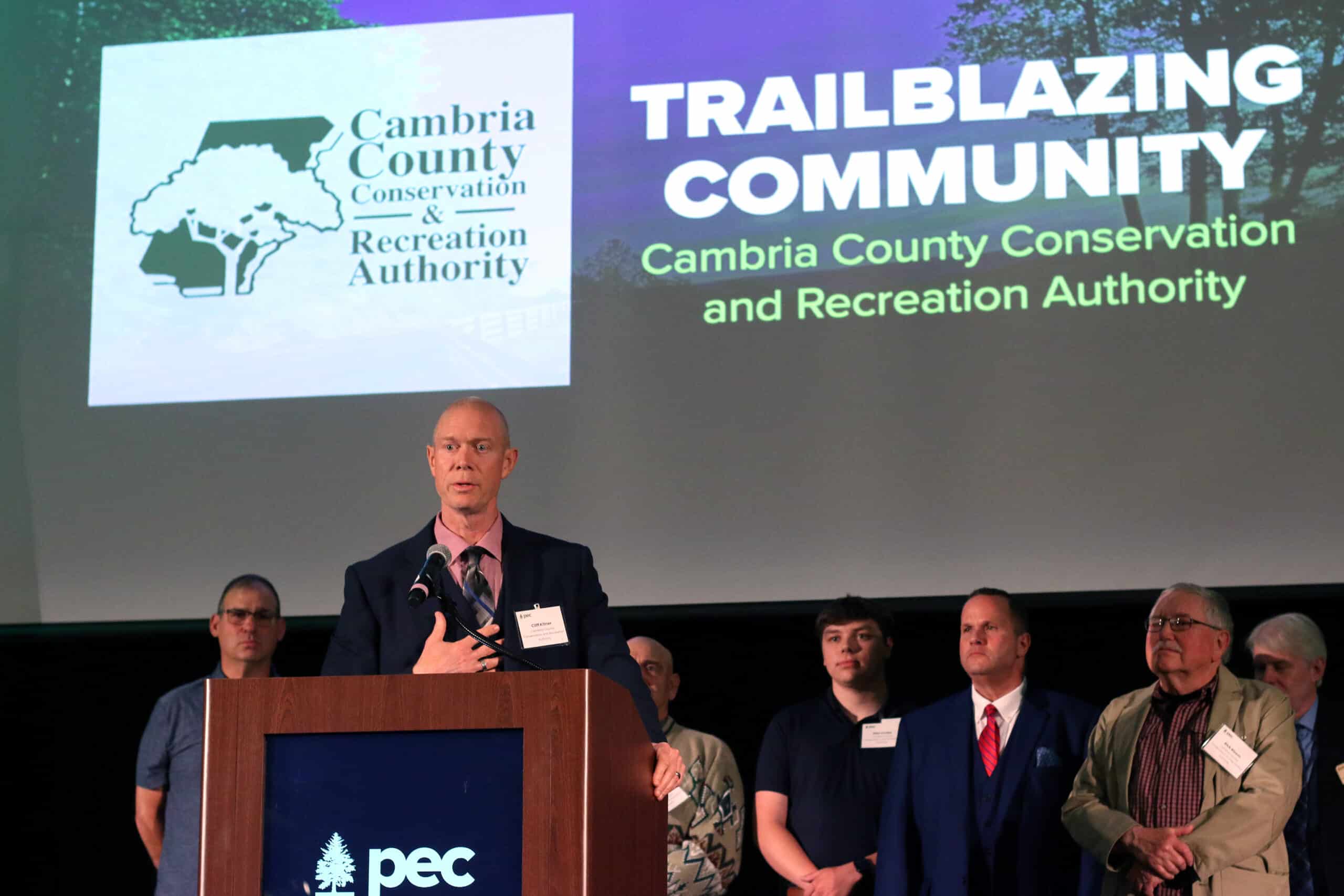 Cambria County Conservation and Recreation Authority Executive Director Cliff Kitner accepts the Trailblazing Community Award during PEC's 2025 Western Pennsylvania Dinner.