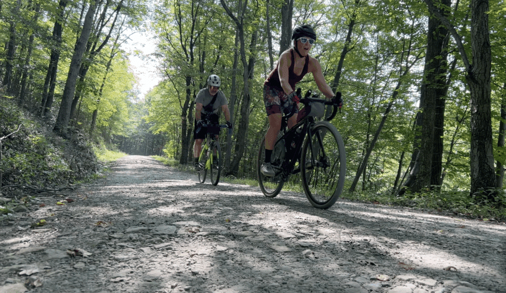 Gravel riders cycling in Moshannon State Forest during the 2022 PEC Public Lands Ride